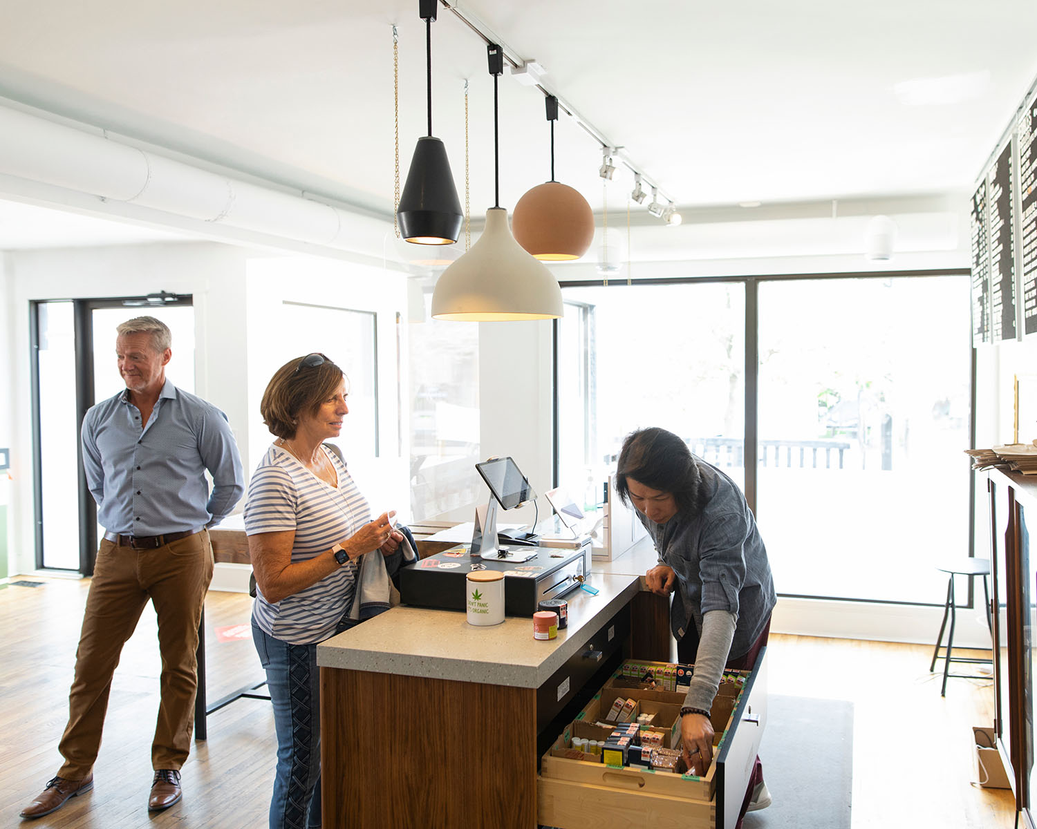 cbd store owner checking out customer