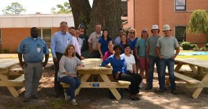 First Port City Bank Team with Greg Harrell's Construction Class and Staff from Memorial Hospital and Manor